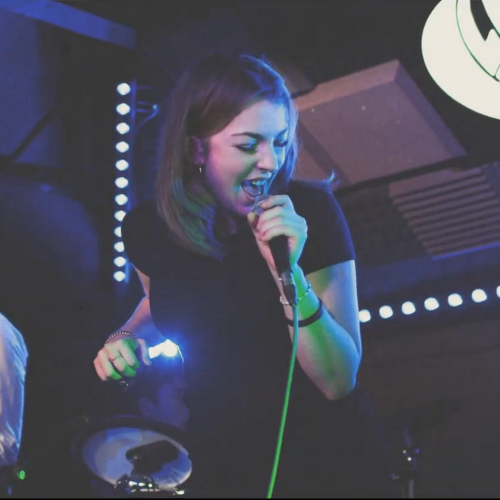 DeRosa Music Franchise Student Singing in a band