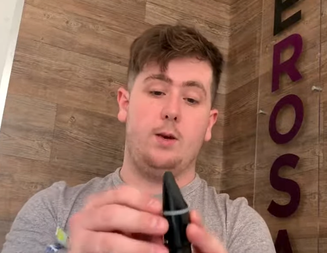 DeRosa Music Saffron Walden owner showing how to put a saxophone reed on a mouth piece
